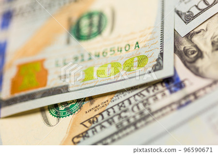 Abstraact of One Hundred Dollar Bill Laying on Flat Surface. 96590671