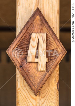 A figure 4 carved from wood in the design of the building. A figure 4 carved from wood in the design of the building. 96591446