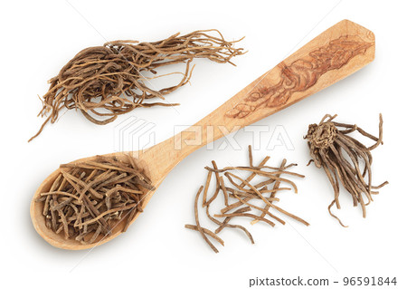 Dried Valerian root in wooden spoon isolated on white background. Valeriana officinalis with full depth of field. Top view. Flat lay 96591844
