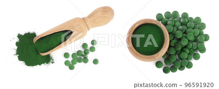 Spirulina algae powder and pills in wooden scoop isolated on white background. Top view Spirulina algae powder and pills in wooden scoop isolated on white background. Top view 96591920