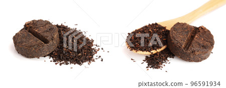 Round flat disc of puer tea isolated on white background. Pressed Chinese fermented Pu-erh tea Round flat disc of puer tea isolated on white background. Pressed Chinese fermented Pu-erh tea 96591934