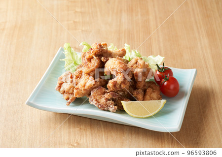 Fried chicken served on a plate 96593806