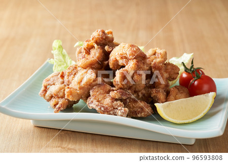 Fried chicken served on a plate 96593808