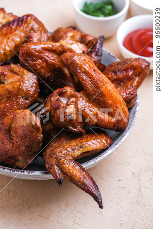 Barbecue chicken wings with sauce on  table. Top view. 96600259
