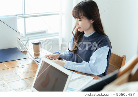 Young woman working in back office 96603487