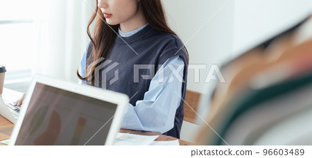 Young woman working in back office 96603489