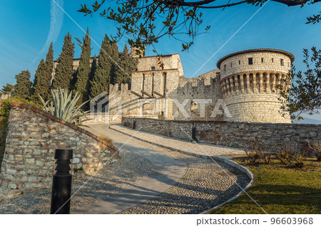 the castle of Brescia on a sunny day against a blue sky the castle of Brescia on a sunny day against a blue sky 96603968