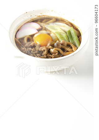 Hot miso stewed udon with beef, shimeji mushrooms, green onion, kamaboko, and egg yolk shot against a white background Hot miso stewed udon with beef, shimeji mushrooms, green onion, kamaboko, and egg yolk shot against a white background 96604173