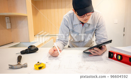 Asian male Interior worker working with construction tools 96604592