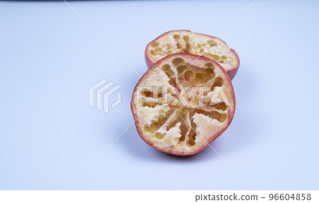 pitted pomegranate halves on a white background,isolated fruit 96604858