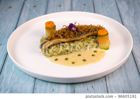 Recipe for fried fillet of sea bass with herb risotto, white wine sauce, fresch creme, roll of Recipe for fried fillet of sea bass with herb risotto, white wine sauce, fresch creme, roll of 96605191