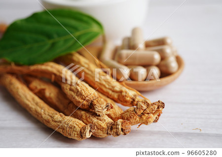 Ginseng roots and green leaf, healthy food. Ginseng roots and green leaf, healthy food. 96605280