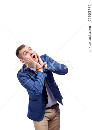 portrait of horrified, surprised, astonished young man looking up isolated on white background portrait of horrified, surprised, astonished young man looking up isolated on white background 96605782