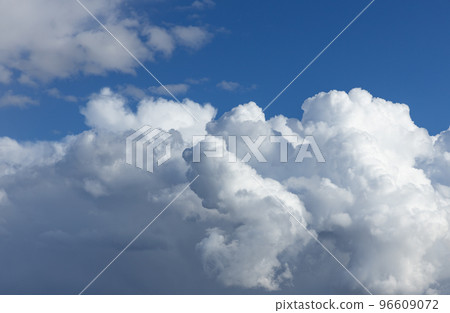 White fluffy clouds in a blue sky 96609072