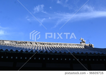 White clouds that look like they were drawn with a brush on the roof of a temple White clouds that look like they were drawn with a brush on the roof of a temple 96609716