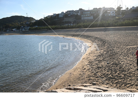 A quiet sandy beach for swimming in the summer A quiet sandy beach for swimming in the summer 96609717