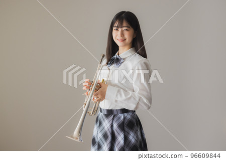 A high school girl with a trumpet 96609844