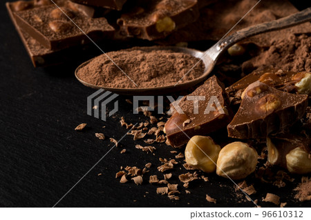 Broken chocolate nuts pieces Broken chocolate nuts pieces 96610312