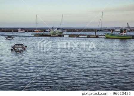 Picnic tables set in the North Sea at a ferry port in evening Denmark 96610425