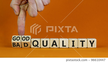 Good or bad quality symbol. Businessman turns cubes and changes words bad quality to good quality. Beautiful orange table orange background. Business good or bad quality concept, copy space. Good or bad quality symbol. Businessman turns cubes and changes words bad quality to good quality. Beautiful orange table orange background. Business good or bad quality concept, copy space. 96610447