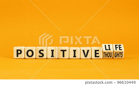 Positive thoughts and life symbol. Concept words Positive thoughts or Positive life on wooden cubes. Beautiful orange table orange background. Business positive thoughts life concept. Copy space Positive thoughts and life symbol. Concept words Positive thoughts or Positive life on wooden cubes. Beautiful orange table orange background. Business positive thoughts life concept. Copy space 96610449