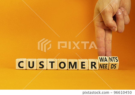 Customer wants and needs symbol. Concept words Customer wants or Customer needs on wooden cubes. Businessman hand. Beautiful orange background. Business customer wants or needs concept. Copy space. Customer wants and needs symbol. Concept words Customer wants or Customer needs on wooden cubes. Businessman hand. Beautiful orange background. Business customer wants or needs concept. Copy space. 96610450