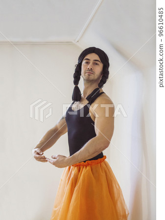 Young muscular man pretending to be a ballerina Young muscular man pretending to be a ballerina 96610485