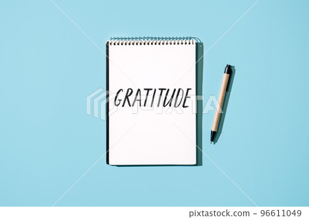 How to Practice Gratitude. Word Gratitude in open notebook on table. Notice good things, appreciate good things. Express gratitude to yourself. Word Gratitude in open notebook on blue background How to Practice Gratitude. Word Gratitude in open notebook on table. Notice good things, appreciate good things. Express gratitude to yourself. Word Gratitude in open notebook on blue background 96611049