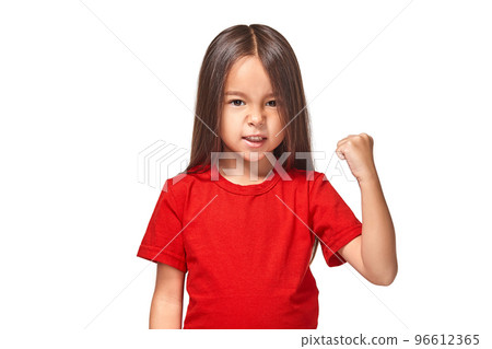 Beautiful girl in red t-shirt shakes her fist 96612365