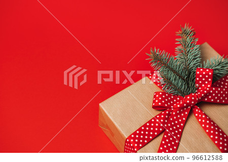 Best Subscription Boxes for Christmas and the Holidays. Xmas Subscription Boxes to Give and Receive. Subscription Gift Box, Care package with red ribbon on red background. Best Subscription Boxes for Christmas and the Holidays. Xmas Subscription Boxes to Give and Receive. Subscription Gift Box, Care package with red ribbon on red background. 96612588