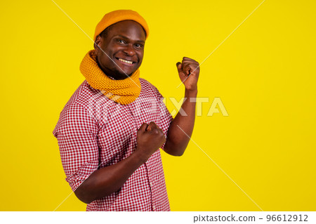 portrait of success attractive african american man in knitted hat and scarf and red checkered shirt excited feeling good-mood.autumn spring fashion look outfit portrait of success attractive african american man in knitted hat and scarf and red checkered shirt excited feeling good-mood.autumn spring fashion look outfit 96612912