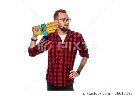Hipster man over white background holding yellow skateboard. Active guy in plaid shirt with copy space Hipster man over white background holding yellow skateboard. Active guy in plaid shirt with copy space 96613183