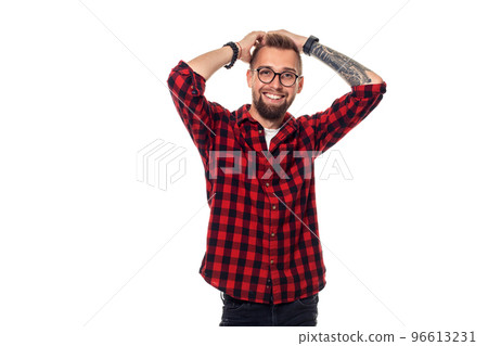 Handsome man model studio portrait. Boy casual style, trendy hipster in checkered shirt look with cool hairstyle Handsome man model studio portrait. Boy casual style, trendy hipster in checkered shirt look with cool hairstyle 96613231