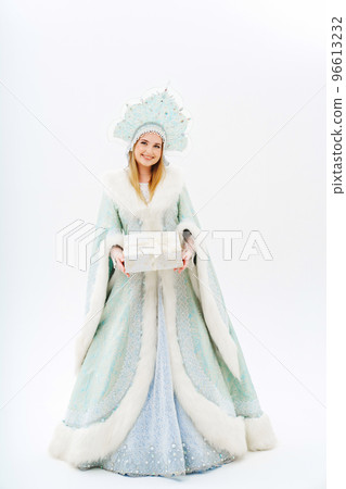 Snow Maiden in a traditional costume with a kokoshnik with gift box on a white. Snow Maiden in a traditional costume with a kokoshnik with gift box on a white. 96613232