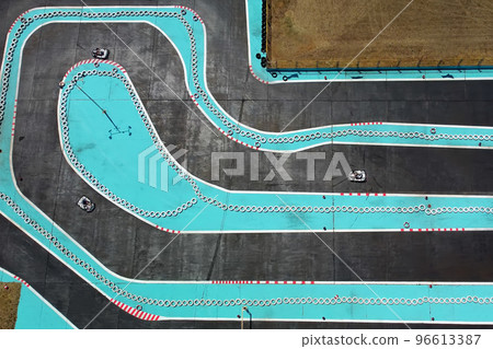 Aerial drone view of carting race track. Karting racetrack view above. Speedway kart field. Aerial drone view of carting race track. Karting racetrack view above. Speedway kart field. 96613387