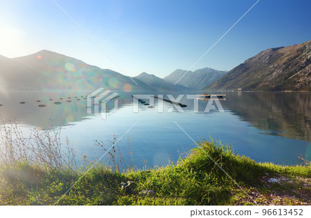 Stunning view of Boka Kotor Bay seascape. Fish farming in Adriatic sea. Cultivation of various types of fish and seafood 96613452