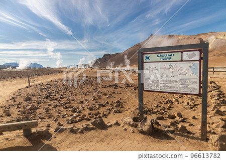 Namafjall is Iceland popular geothermal area with a unique landscape of steaming pools and mudpots. Sign post is in Icelandic and English language. Namafjall is Iceland popular geothermal area with a unique landscape of steaming pools and mudpots. Sign post is in Icelandic and English language. 96613782