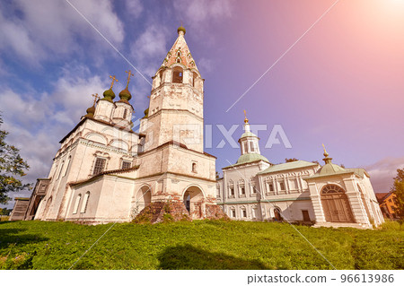 Old orthodox church at village. Summer view with floral meadow. Sun flare 96613986