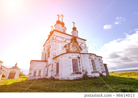 Old orthodox church at village. Summer view with floral meadow. Sun flare Old orthodox church at village. Summer view with floral meadow. Sun flare 96614013