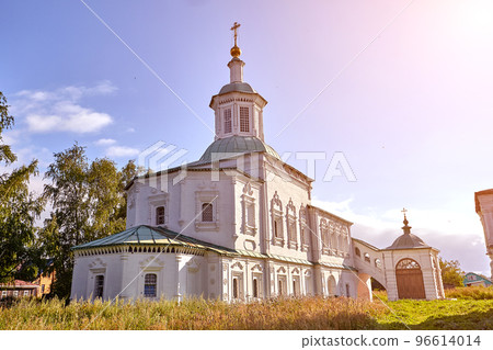 Old orthodox church at village. Summer view with floral meadow. Sun flare 96614014