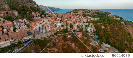 Panoramic aerial view of Isola Bella island and beach in Taormina. Giardini-Naxos bay, Ionian sea coast, Taormina, Sicily, Italy Panoramic aerial view of Isola Bella island and beach in Taormina. Giardini-Naxos bay, Ionian sea coast, Taormina, Sicily, Italy 96614089