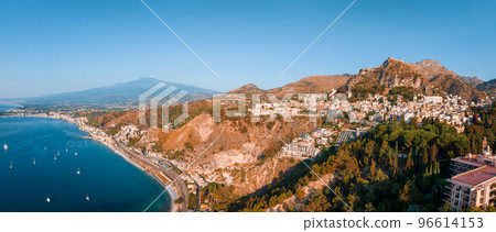 Beautiful aerial view of the Taormina town in Sicily, Italy. One of the most beautiful towns in Italy. Beautiful aerial view of the Taormina town in Sicily, Italy. One of the most beautiful towns in Italy. 96614153
