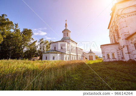 Old orthodox church at village. Summer view with floral meadow. Sun flare 96614264