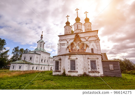 Old orthodox church at village. Summer view with floral meadow. Sun flare 96614275