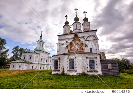 Old orthodox church at village. Summer view with floral meadow. 96614276