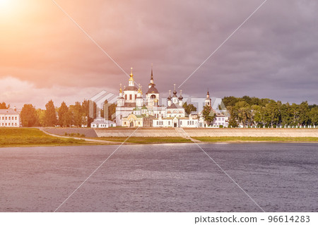 A small church and the bell tower on the banks of the river, Russia 96614283