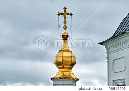 Eastern orthodox crosses on gold domes, cupolas, against blue sky with clouds Eastern orthodox crosses on gold domes, cupolas, against blue sky with clouds 96614292