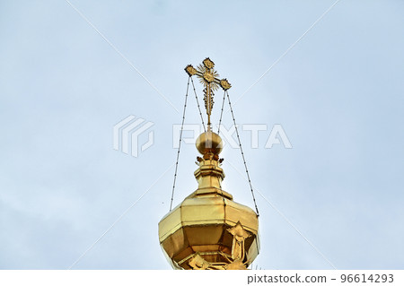 Eastern orthodox crosses on gold domes, cupolas, against blue sky with clouds Eastern orthodox crosses on gold domes, cupolas, against blue sky with clouds 96614293