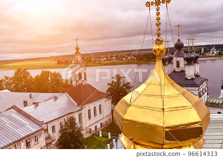 Eastern orthodox crosses on gold domes, cupolas, against blue sky with clouds Eastern orthodox crosses on gold domes, cupolas, against blue sky with clouds 96614313