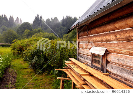Front view of wooden house in russian village in sunny summer day 96614336